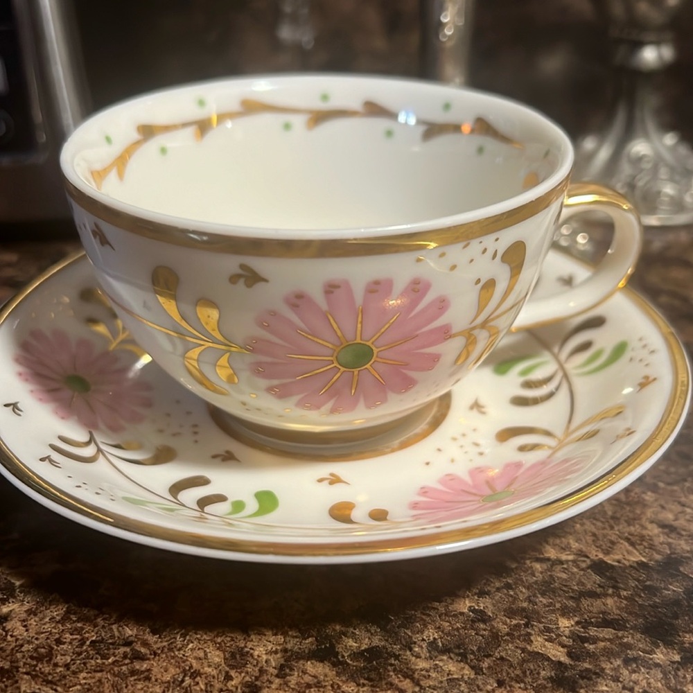 Cute pink cream and gold tea cup